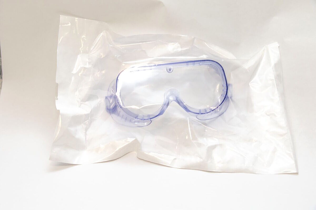 Front view of packaged VWR indirect-ventilation disposable safety goggles, universal size
