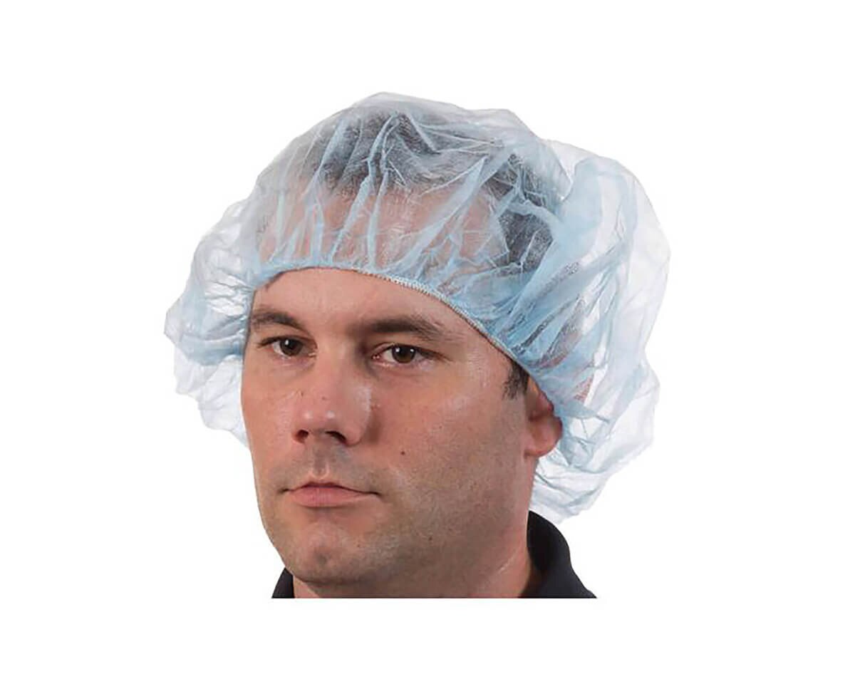 Man wearing an International Enviroguard blue 21-inch polypropylene bouffant cap