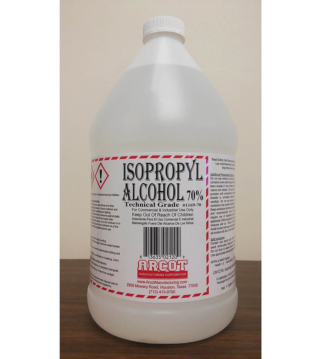 Single 1-gallon jug of technical-grade 70% Isopropyl Alcohol displayed on a countertop, showing full warning label and manufacturer information.