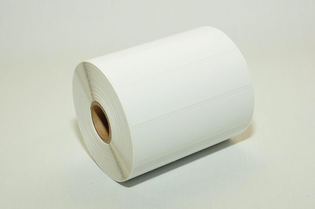 Continental Datalabel 4" × 1" white direct thermal labels shown on an angled roll