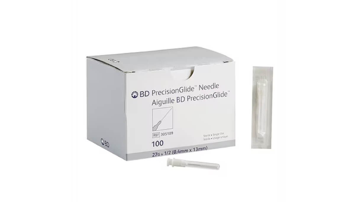 BD PrecisionGlide 27 G × 1/2-inch hypodermic needle and individual sterile package displayed beside the 100-count box