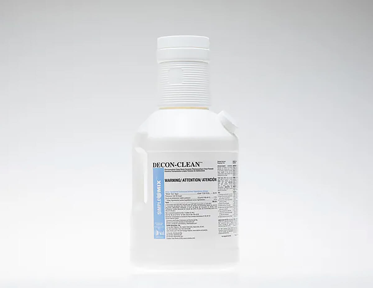 Side-by-side display showing one unwrapped 1-gallon DECON-CLEAN bottle next to one sterile-bagged bottle.