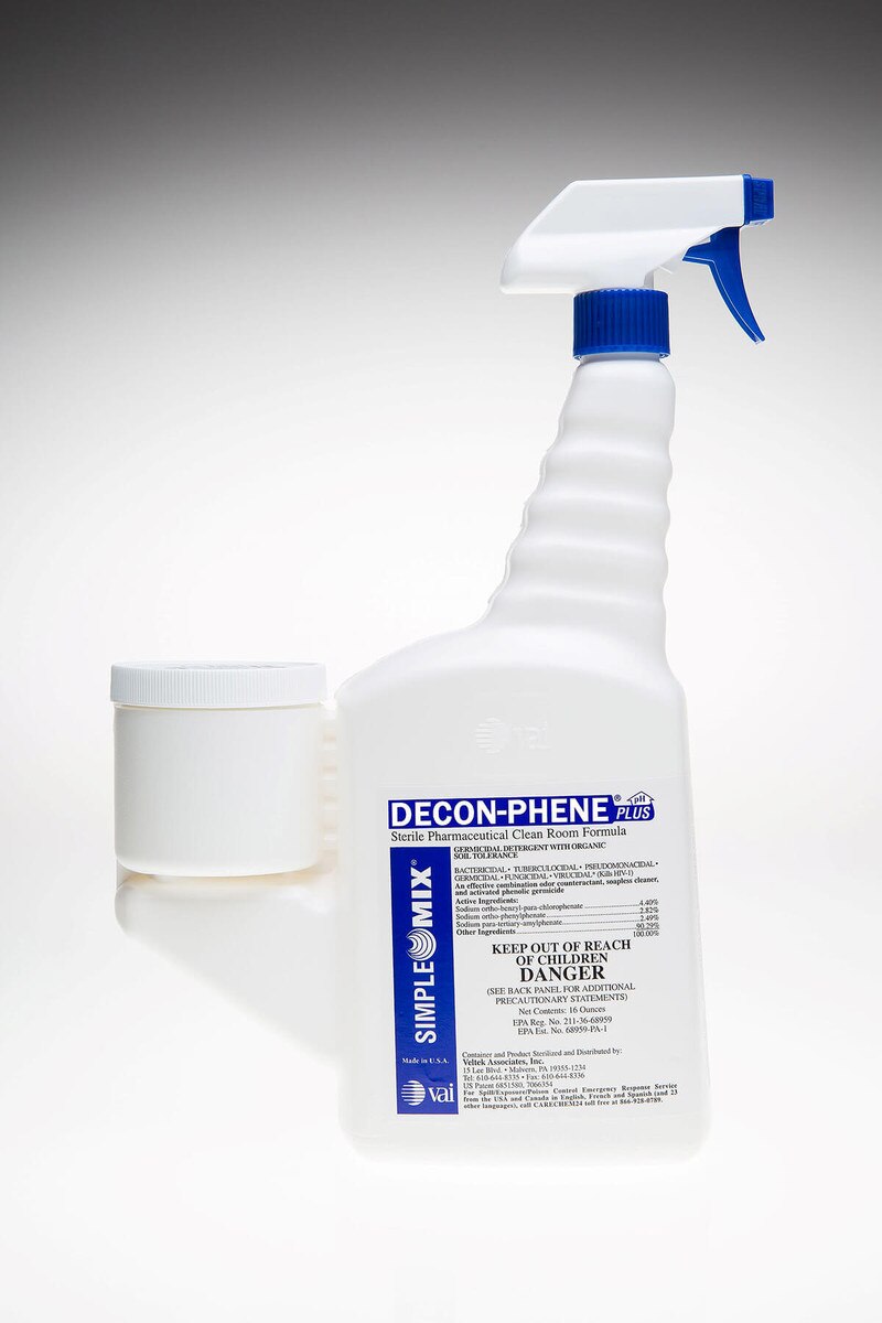 Cut-out image of Decon-Phene 16oz sterile trigger spray bottle with blue nozzle and attached measuring cup.