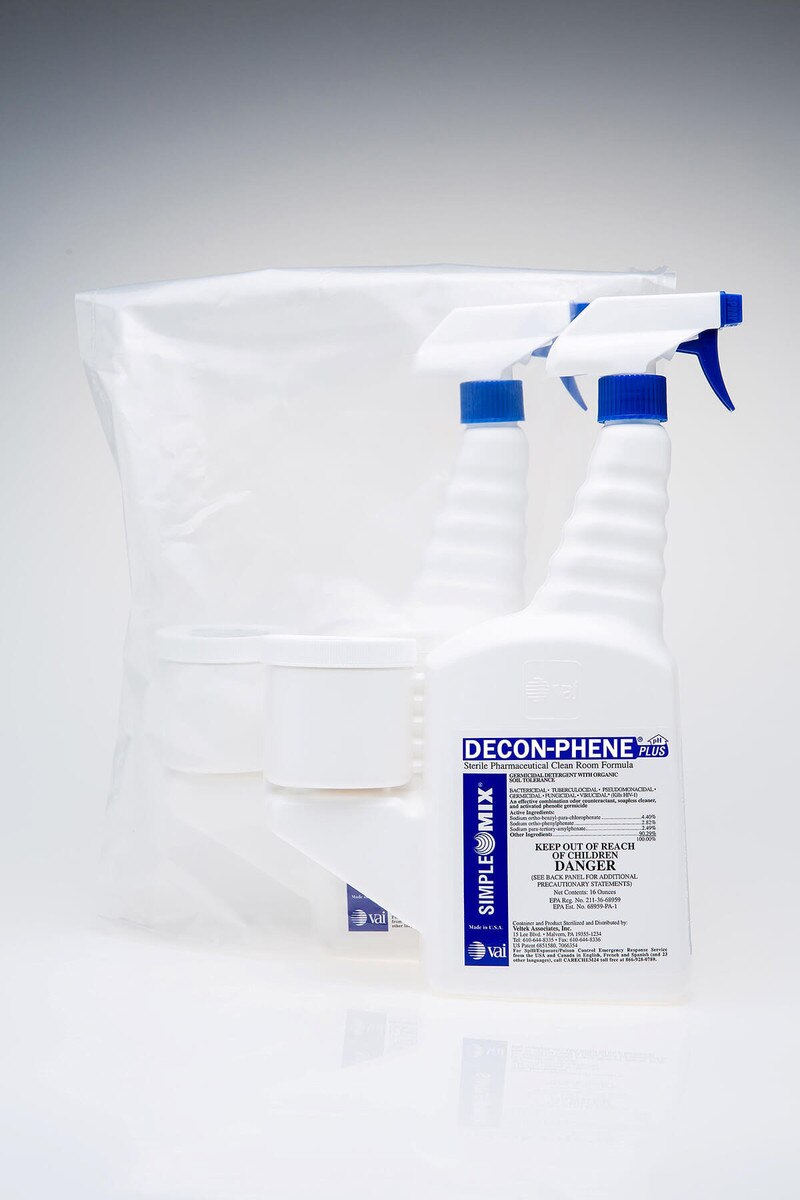 Two Decon-Phene 16oz sterile trigger spray bottles shown side-by-side, one bagged and one unbagged.