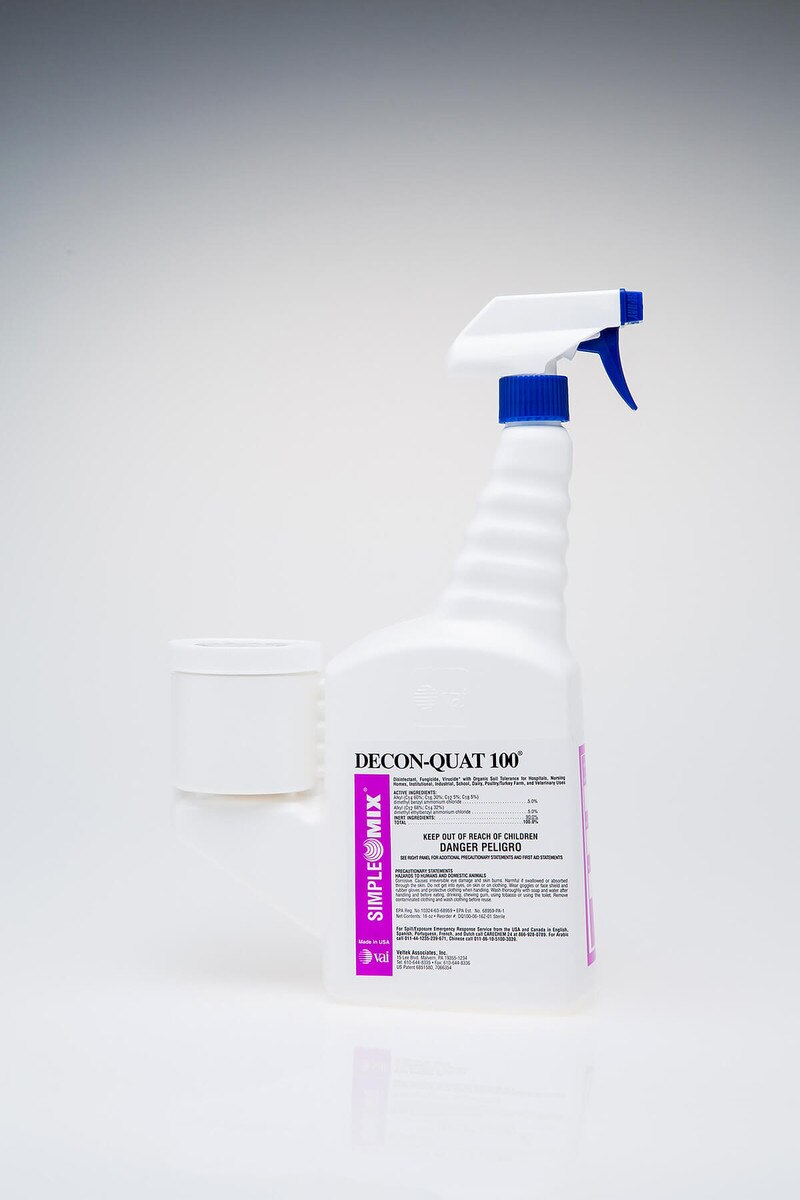 Close-up product image of Decon-Quat 100, 16oz SimpleMix bottle with integrated measuring chamber and spray trigger head, standing upright.