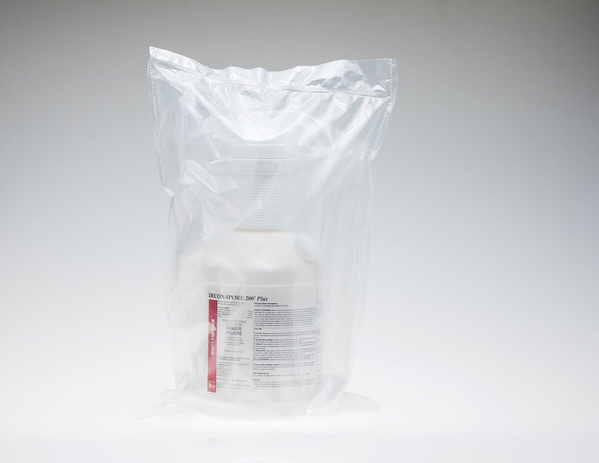 Sterile DECON-SPORE 200 Plus 5% bottle sealed inside a clear sterile packaging bag.