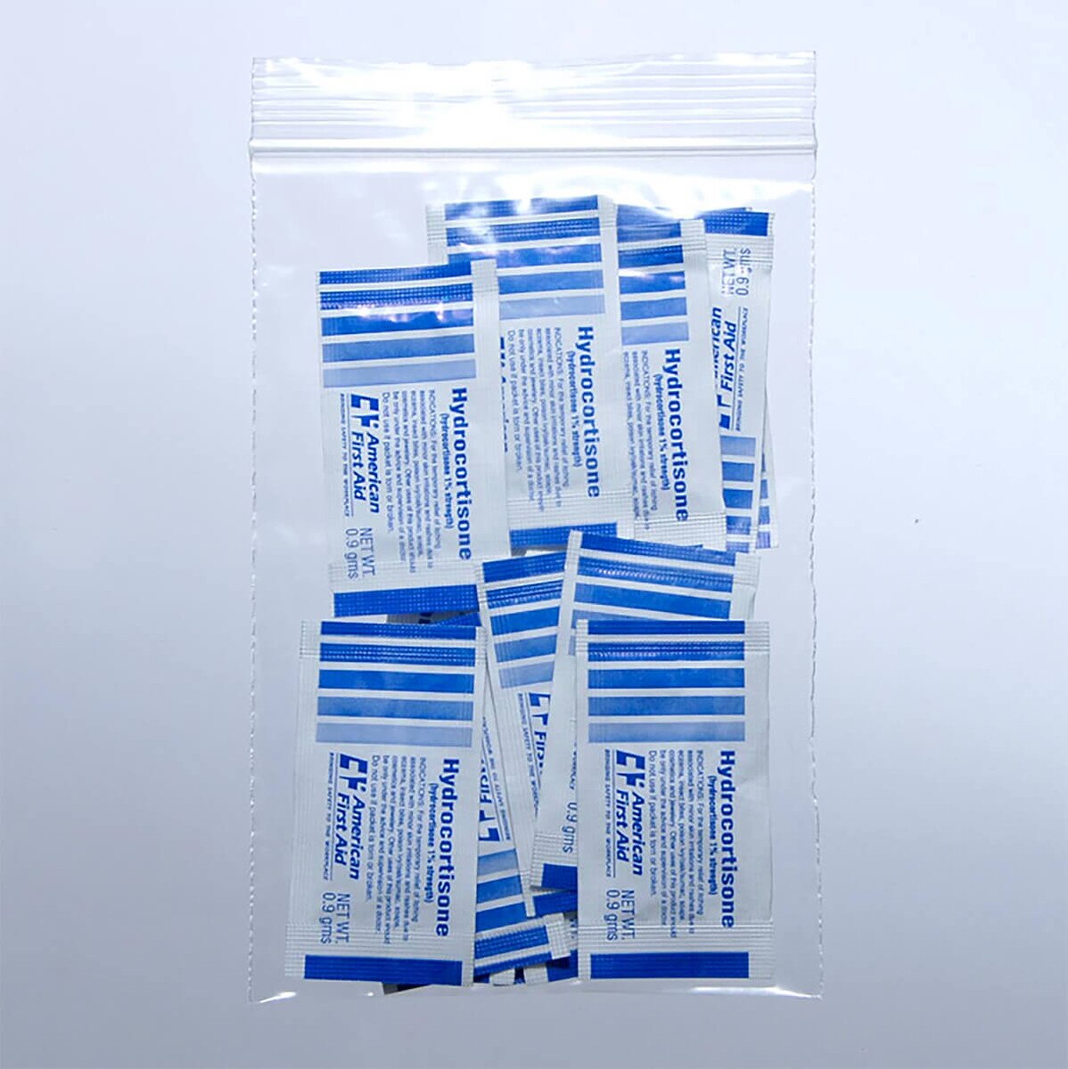 LK clear 2 mil single-track reclosable zipper bag holding hydrocortisone first-aid cream packets