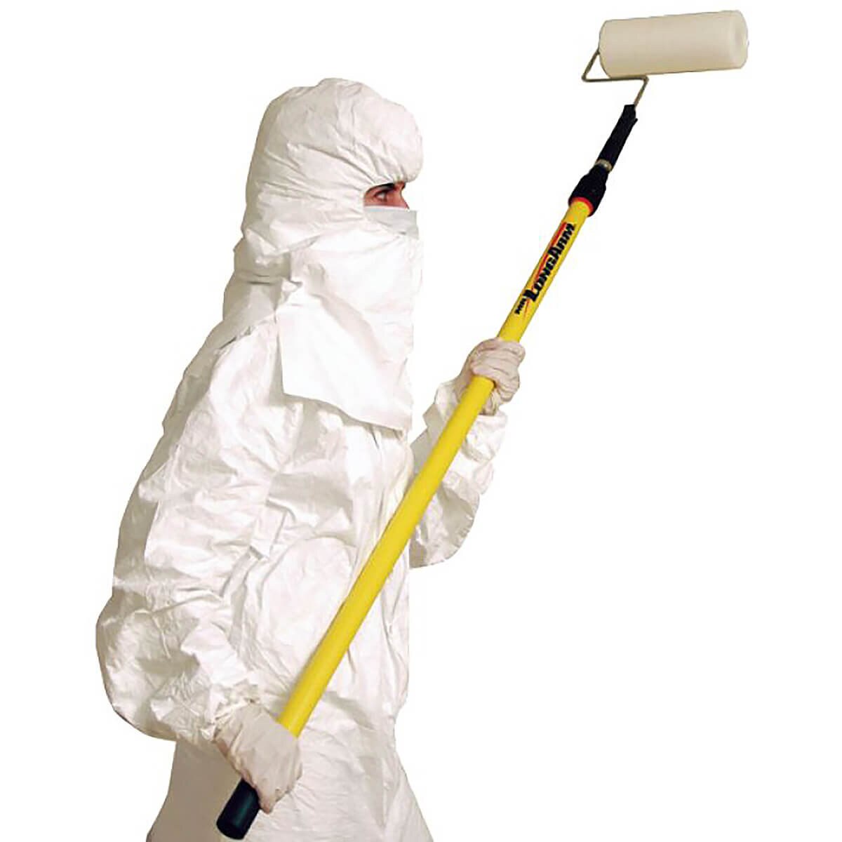 Worker in full cleanroom protective suit using a yellow extension pole with the 9-inch tacky roller to clean overhead surfaces.