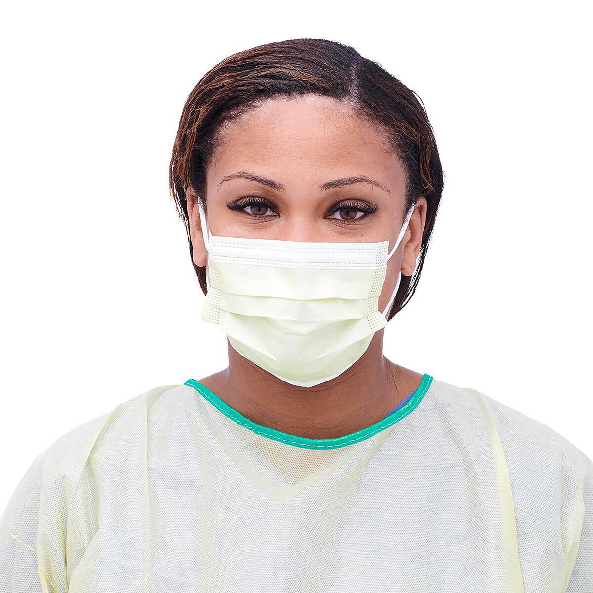 Healthcare worker wearing a Medline Level 1 pleated isolation face mask with ear loops, front view