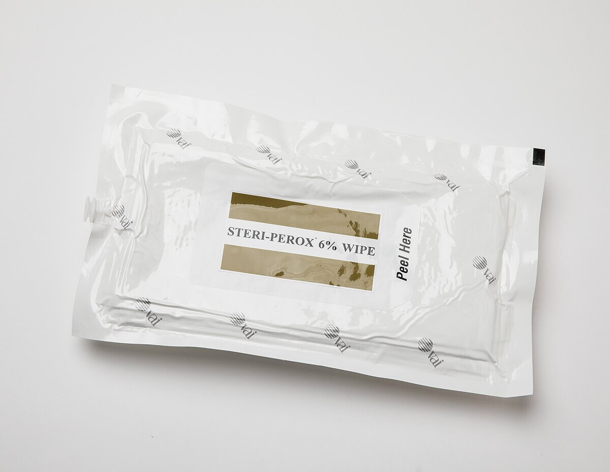 Close-up Steri-Perox 6% hydrogen peroxide wipe pouch with peel-open tab for sterile cleanroom surface wiping.