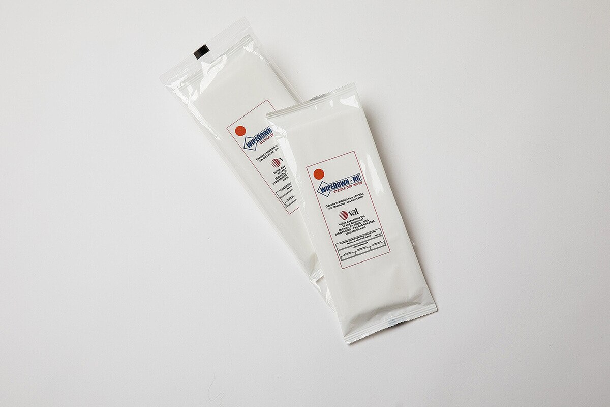 Two sealed packs of WipeDown HC sterile dry wipes displayed side-by-side on a clean white surface